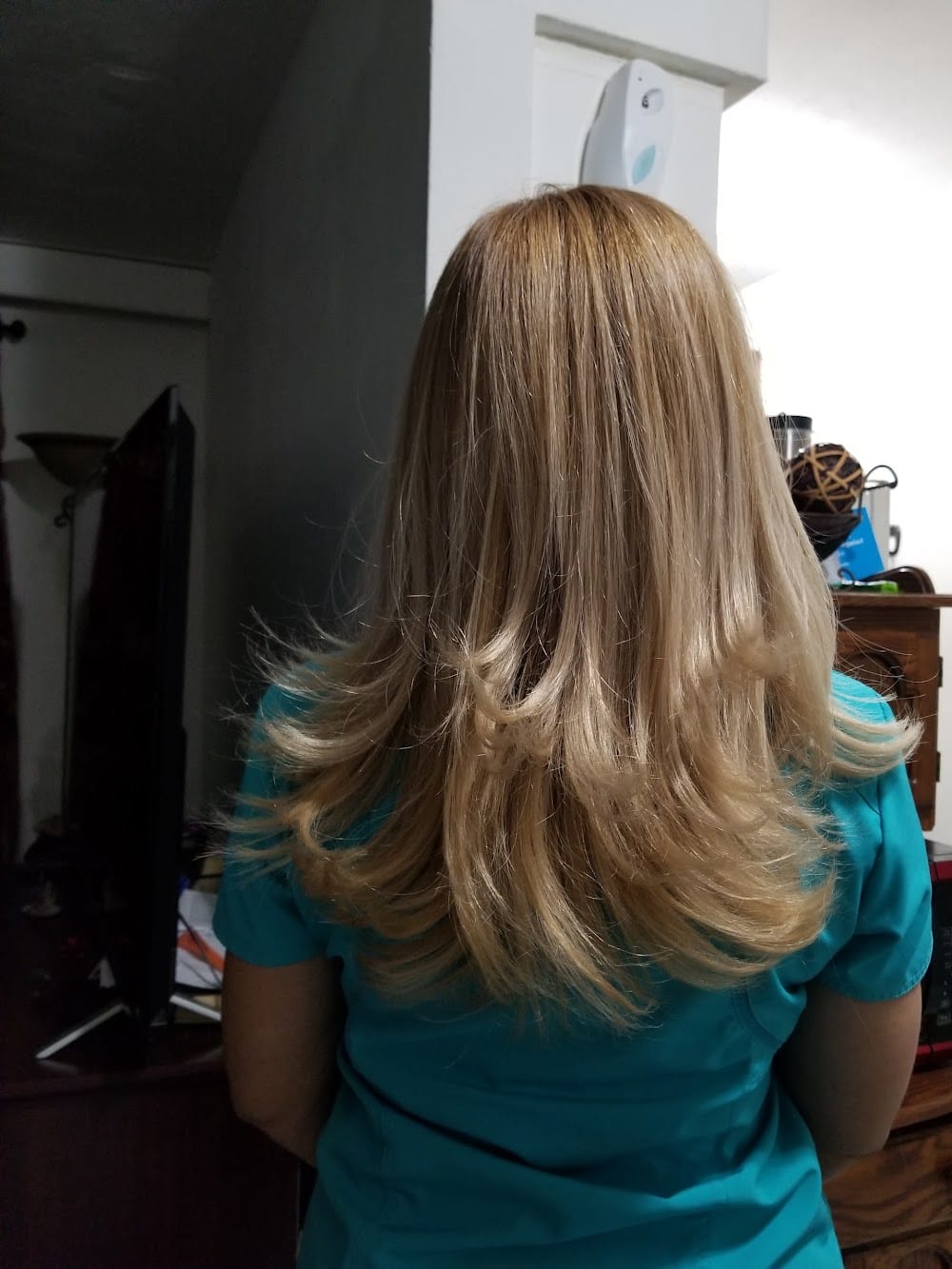 Soft blonde layers blown out with movement